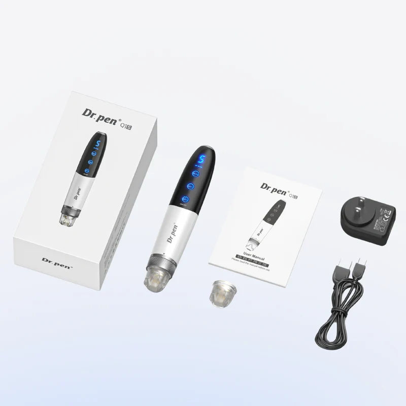 Sleek silver and black Dr. Pen Q1S electric beauty device with blue LED display, box, manual, charger, and cartridge.