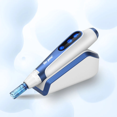 Dr. Pen A11 Ultima Pro microneedling pen in white and blue with LED display, on its inductive charging stand.