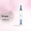 Dr.Pen A9 Ultima Pro microneedling pen, white and blue, on a pink background.