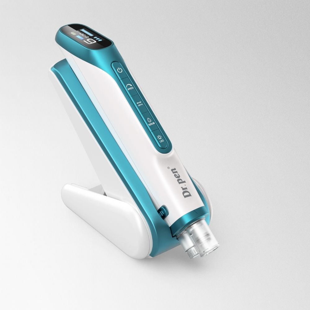 Dr.pen H6 professional microneedling pen in white and teal with LED display, on its sleek charging stand.